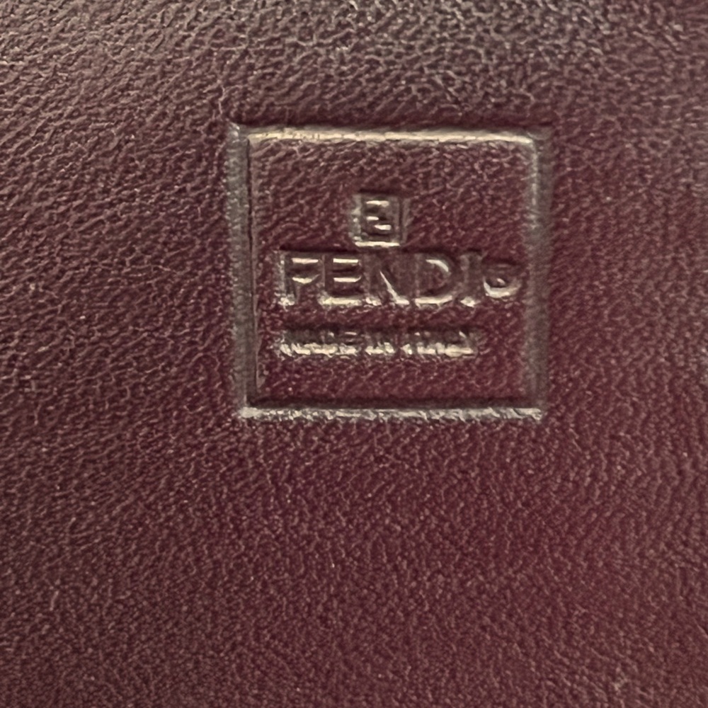 Fendi Pequin canvas with Burgandy Leather on inside.